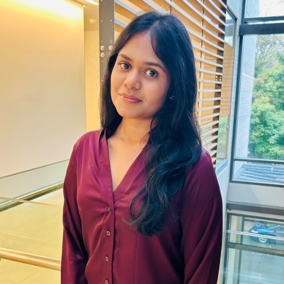 Portrait of Meara Sanjayan in an academic setting.