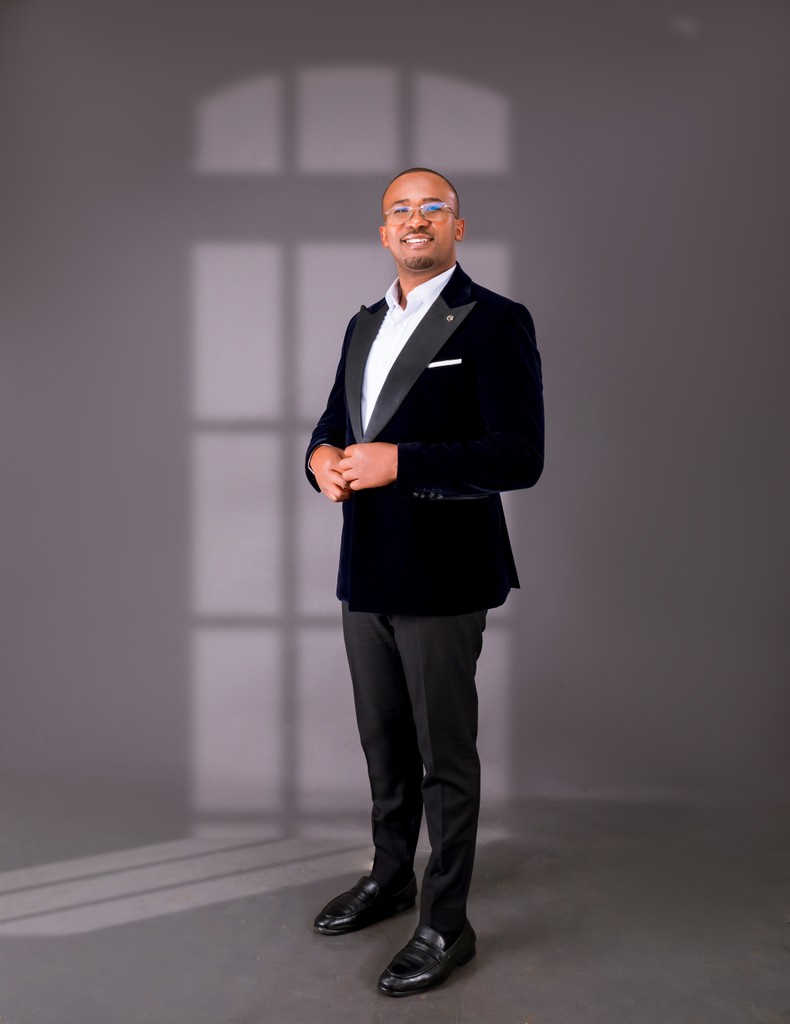 Formal studio portrait of Davis Amani.