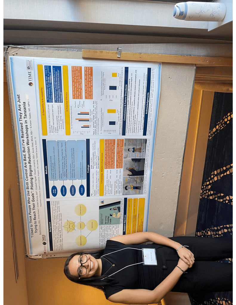 Rachel Di Iorio beside a research poster at a scientific meeting.